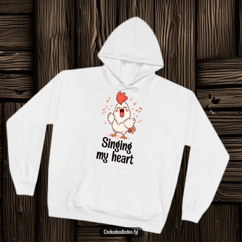 Funny rooster hoodie featuring a character singing loudly with a beaming smile, surrounded by musical notes, perfect for cozy and musical wear.